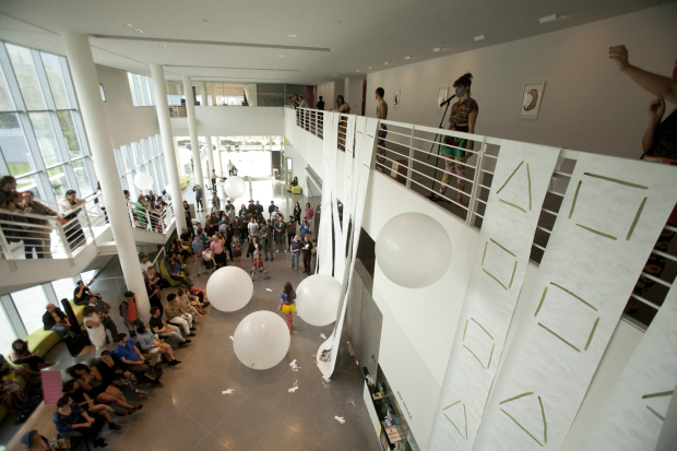 People on the ground floor watching people perform on the second floor (650x470)