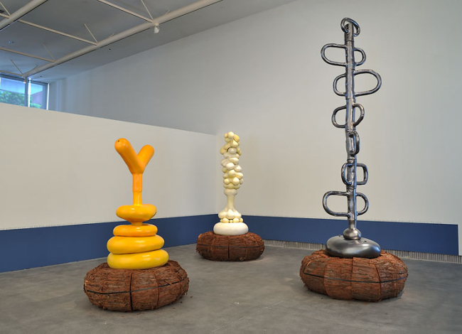 A yellow, white, and black statue/art installation (650x470)