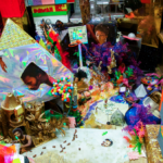 Various colorful items and photos of people making up a neighborhood (cropped)