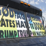 A tank with placards inside that you can see from the windshield; “God hates Trump” (650x470)