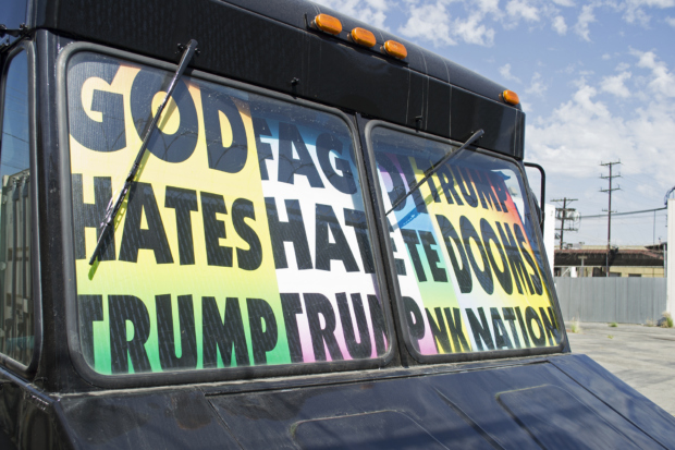 A tank with placards inside that you can see from the windshield; “God hates Trump” (650x470)